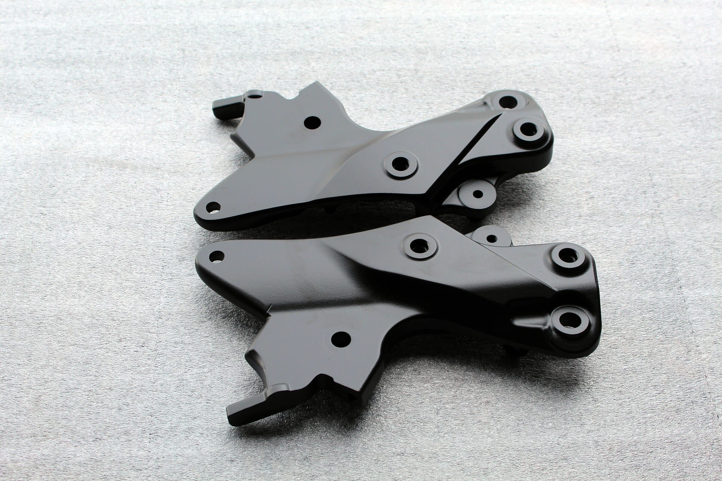 Pair of black powder-coated steel brackets