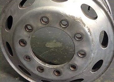 Truck rim before polishing: dull and stained